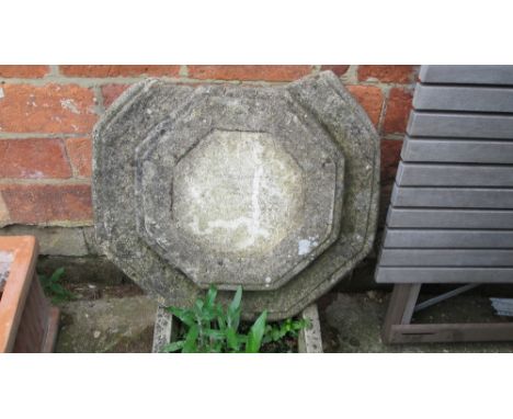 A reconstituted stone planter and sun dial base