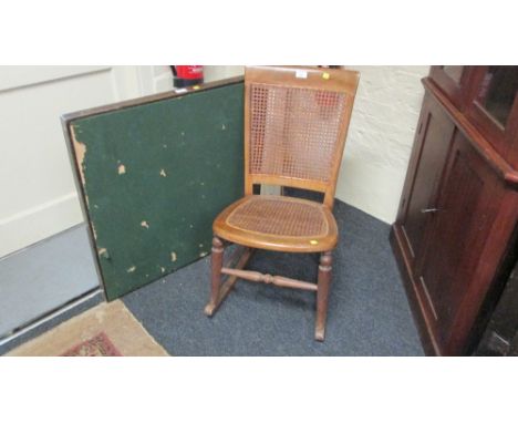 A late 19th century beech bergere caned rocking chair, together with an Edwardian folding card table