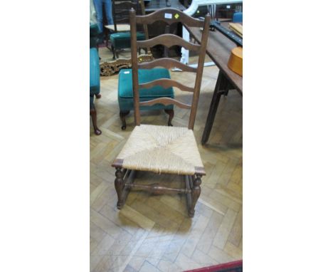 A 19th century Lancashire ladder back low nursing, rocking chair 