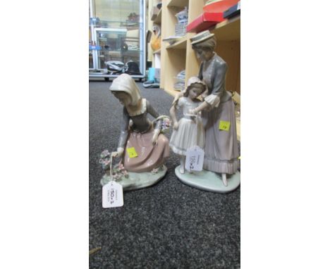 Two Lladro porcelain groups, one modelled as a young lady kneeling and picking flowers, the other as a mother consoling her d