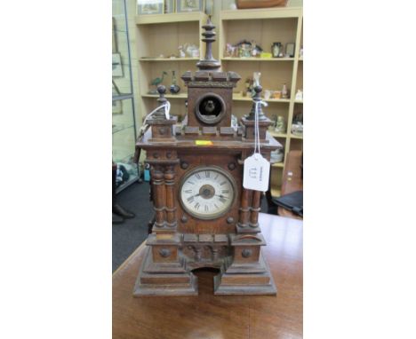 An early 20th century, probably Austrian 'Castle' form 30-hour cuckoo clock, with brass stud work detail
