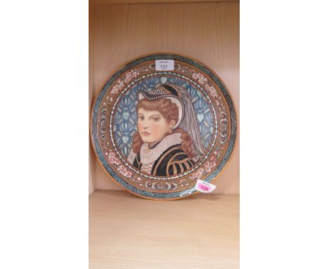 A Victorian Minton's Art Pottery Studio Kensington Gore circular charger, painted with a bust study of a woman in 16th centur