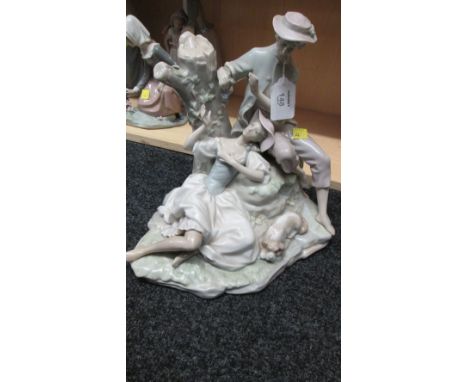 A Lladro porcelain figure group, modelled as a courting couple with attendant sleeping dog beside a tree