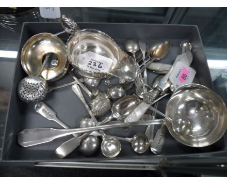 A French Art Deco ladle, with stylised panelled fiddle pattern heads, together with a Victorian silver sauceboat, London 1892