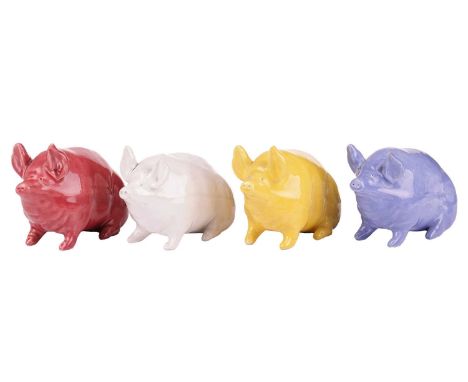 A set of four Wemyss pig in different glazes, impressed marks to the base of three, with a 'Rogers de Rin Antiques' to one, e