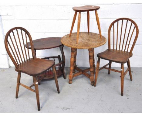 Two Ercol style stick back chairs, an Ercol style light oak stool, a pine table with a rounded top and a magazine rack (5).