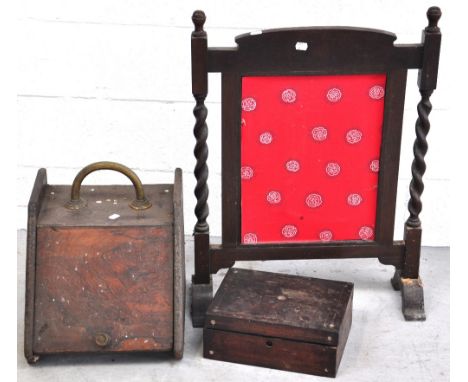 An early 20th century oak fire screen with barley twist supports, a mahogany coal scuttle and a late 19th early 20th century 