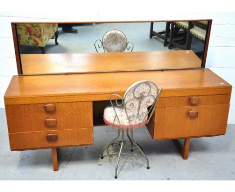 A retro 1970s light oak mirror back dressing table, width 165cm and a metal back dressing table chair (2).