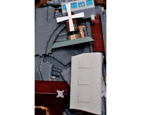 A quantity of Ertl "Thomas The Tank Engine" track and lineside buildings to include an engine shed and windmill.
