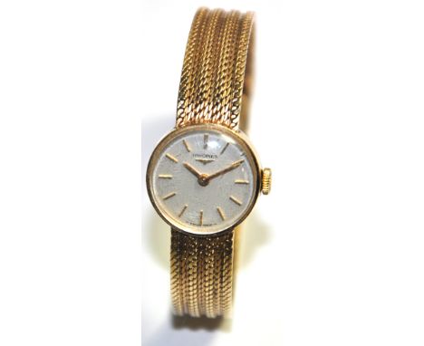A ladies 9ct gold Longines wristwatch, the enamel dial set with baton markers, engraved to the back "P.Thompson 1938 -1968".