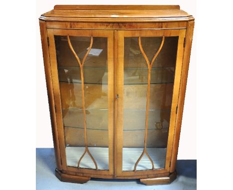 A c.1930s walnut display cabinet with double glazed doors and two interior glass shelves and an oak Ercol "Old Colonial" styl