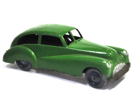 A Wells-Brimtoy "Pocketoy" clockwork saloon car in green. CONDITION REPORT Excellent overall, very slight paint loss to the h