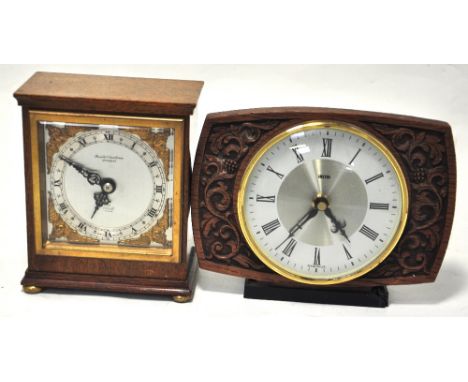A Boodle and Dunthorne of Liverpool oak cased mantel clock on bun feet, silvered dial set with Roman numerals and gilt angeli