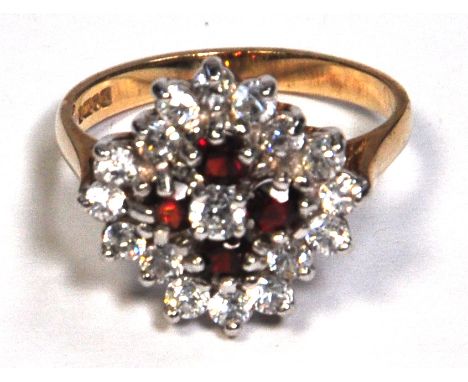 A ladies 9ct gold floral set dress ring, red and white stones, size O, approx weight 3.6g.