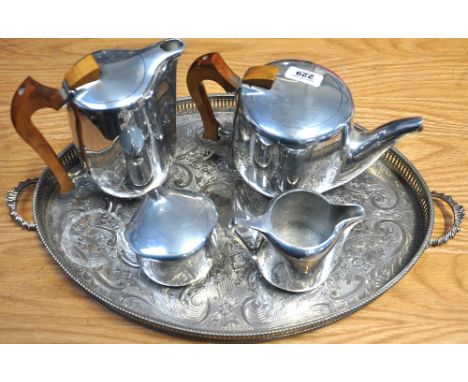 A four piece Piquot ware tea service on a twin handle silver plated gallery tray.