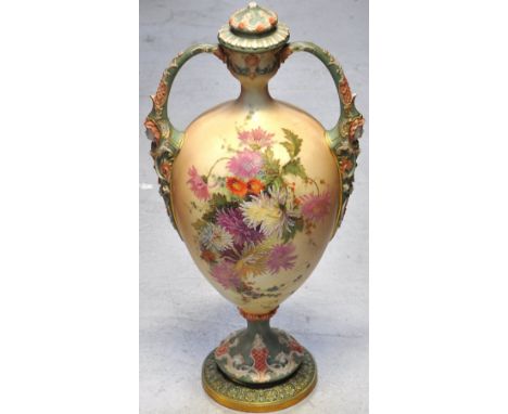 A large Royal Worcester blush ivory twin handle vase and cover with finial top (af), hand painted floral decoration with face