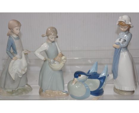 Four Nao figures, a duck, a young girl with cats in a basket, a girl with a dog and a girl holding a swan (4).