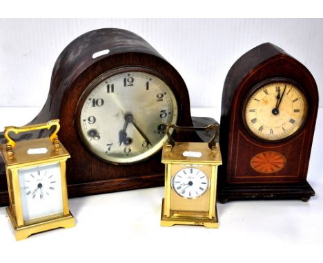 A mid 20th century oak cased Napoleon hat mantel clock, two modern brass cased carriage clocks and an Edwardian lancet inlaid