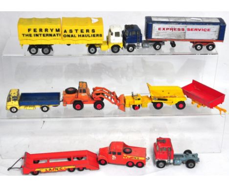 Four assorted playworn Corgi commercial vehicles to include "Express Service" articulated lorry, a "Ferrymaster" articulated 