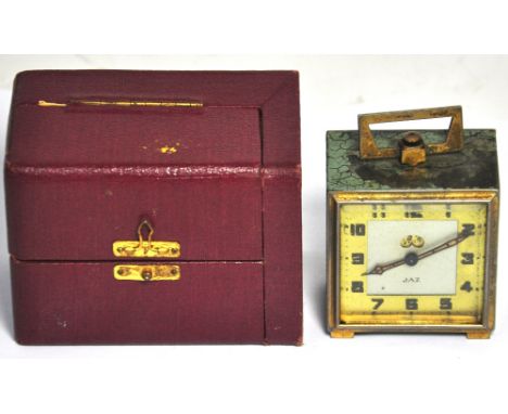 A early 20th century French cased travelling alarm clock.