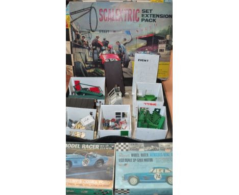 A quantity of vintage Scalextric and plastic construction kits. CONDITION REPORT Playworn condition. The majority are unboxed