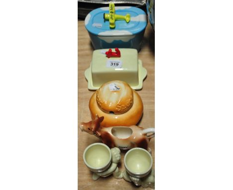 A small collectors lot to include two Lurpack egg cups, a Jersey cow creamer and an Anchor butter dish.  Also an Utterly Butt