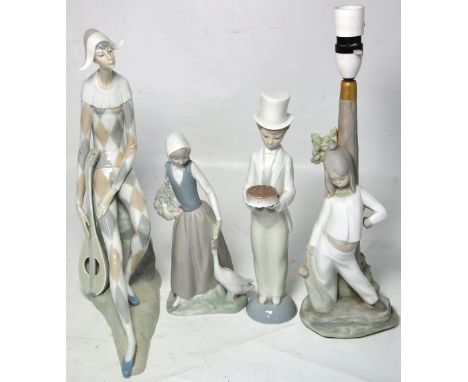 A Nao figure of a young boy wearing a top hat, a figure of a young girl with a goose, and a similar figural table lamp (3). C