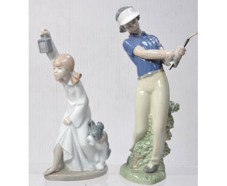 Two Nao figures, the girl holding a lamp and a figure of a golfer (2).