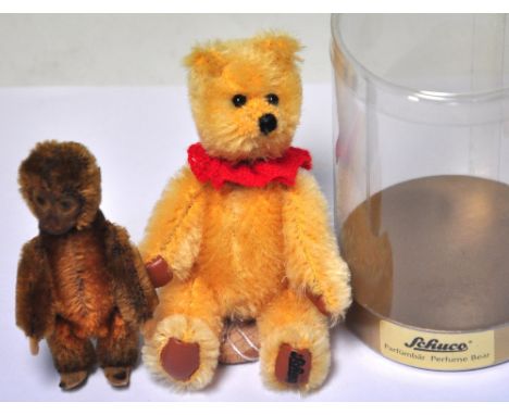 A 19th century miniature perfume bottle modelled as a monkey and a modern Steiff teddy bear example (2).