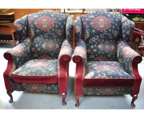 A pair of reproduction Queen Anne style armchairs, navy and burgundy tapestry and upholstery on cabriole legs (2).