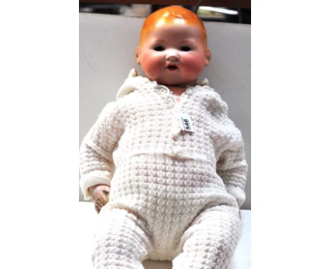 An large Armand Marseille bisque head doll, inscribed to the back of head "A.M. Germany 351/8k", height 56cm (af). CONDITION 