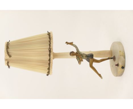 Art Deco painted spelter and alabaster figural table lamp, the base supporting a dancer in a silvered jacket and short pleate