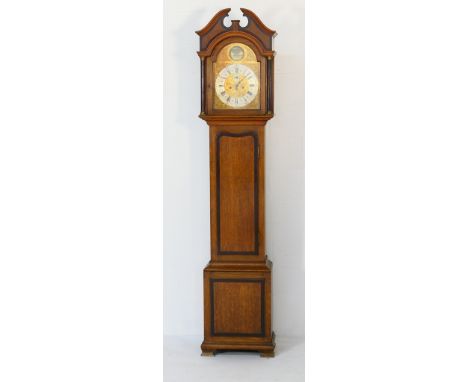 Oak and mahogany eight day longcase clock, the hood with broken architectural pediment over brass capped reeded columns flank