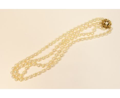 Cultured pearl double strand necklace, the pearls of approximate uniform size, 6-7mm diameter, united by a 9ct yellow gold co