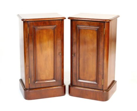 Pair of Victorian mahogany pot cupboards, circa 1860-90, each having a moulded panel door opening to a single shelf over a pl