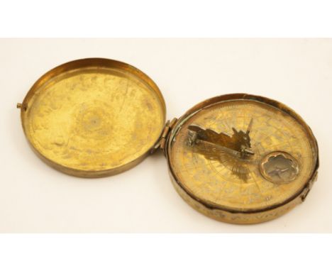 Bedouin brass Qibla compass, 19th Century, traditional circular form with hinged engraved cover opening to a small compass be