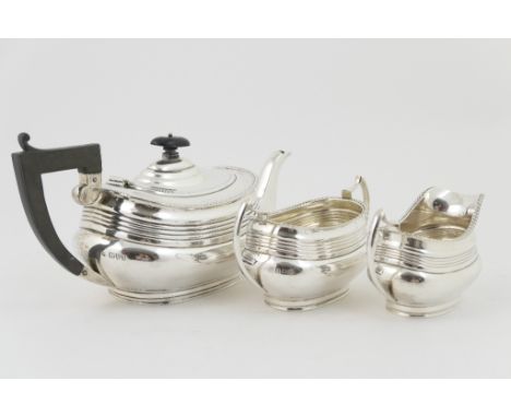 George V silver three piece tea service by S Blanckensee & Son Ltd, Chester 1926 and Birmingham 1926, in Georgian style of bo