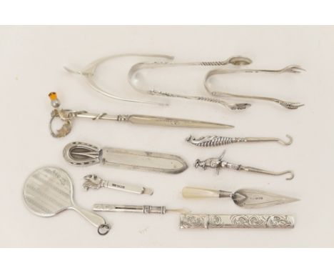 Number of silver collectables including a pair of silver wishbone sugar tongs, Birmingham 1926, two pairs of silver sugar ton