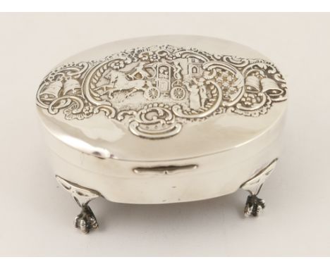 Edwardian silver ring box, by William Comyns & Sons Ltd, London 1903, oval form, the hinged cover repousse decorated with a w