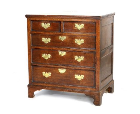 George II oak chest of drawers, circa 1740, fitted with two short and three long graduated drawers, with brass swan neck and 