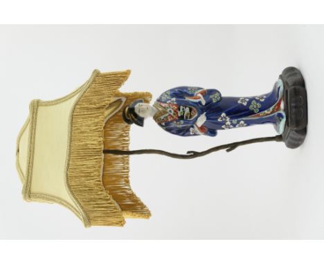 Japanese figural porcelain table lamp, having a tasselled shade supported over a stand with a porcelain figure of a Bijin, de