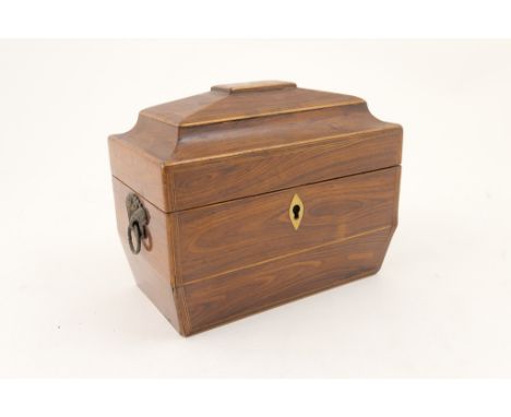 Regency rosewood and inlaid sarcophagus tea caddy, circa 1810, opening to reveal twin caddy interior with covers, pressed met