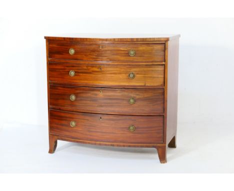Regency mahogany bowfront chest of drawers, circa 1820, the top crossbanded and with boxwood edging, fitted with four graduat