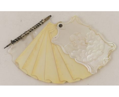 Early Victorian mother of pearl and ivory notebook, circa 1850, the cover carved in low relief with angels sitting amidst clo