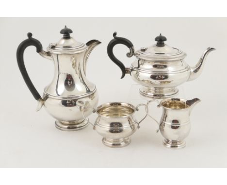 George V silver four piece tea service, Birmingham 1932, comprising lidded baluster teapot with ebony finial and handle, 14cm