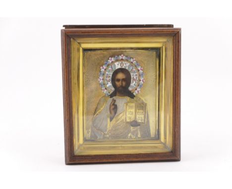 Russian Orthodox silver gilt and champleve enamelled icon (oklad), Moscow, circa 1908-26, the painted feature of Christ borde