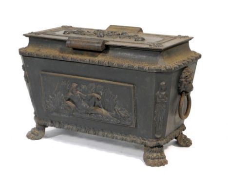 Regency cast iron coal depot, of sarcophagus form with heavy hinged cover, twin lions mask ring handles, the front panel cast
