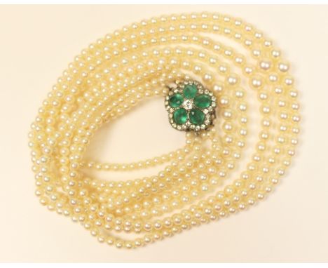 Cultured pearl multi-strand necklace, having five rows of graduated pearls, 2-7mm diameter, united by a flowerhead clasp in w