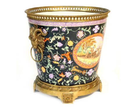 Large and decorative hand decorated porcelain wine cooler, mounted with brass rams head ring handles and decorated with panel