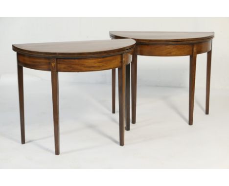 Pair of late George III mahogany and inlaid demi-lune folding tables, circa 1800, each crossbanded and with boxwood string in